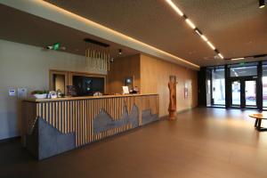 a lobby of a restaurant with a reception desk at Casa Calfelor Kolping Timișoara in Timişoara