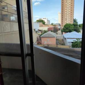 a view of a city from a window at Apartamento no Centro de Campo Grande in Campo Grande