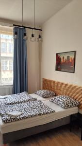 Postel nebo postele na pokoji v ubytování A Plus Hostel - Centrum
