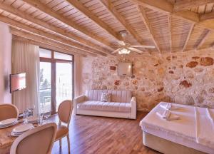 a living room with a couch and a table at Luna Kaş in Kaş