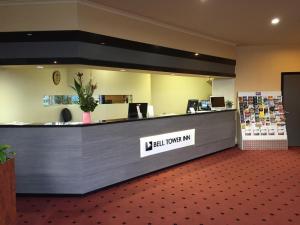 a lobby with a cashier counter in a building at Bell Tower Inn in Ballarat