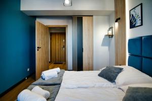 Łóżko lub łóżka w pokoju w obiekcie Apartament No 61 Blue Holiday Home Zator