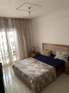 Кровать или кровати в номере Résidence Amwej