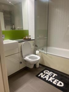 a bathroom with a toilet and a sink and a shower at Luxury 1-Bed Apartment in the heart of Leicester in Leicester