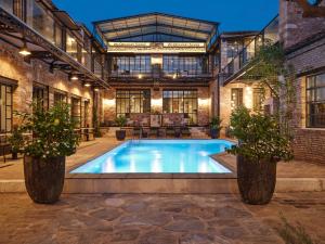an indoor pool in a building with two potted plants at Not Boutique Hotel in Athens