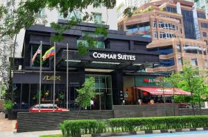 een restaurant met een vlag voor een gebouw bij CORMAR SUITES 163 SUPER KING BED STUDIO near Petronas Twin Tower KLCC KL Convention Center in Kuala Lumpur