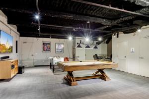 a large room with a pool table in it at Urban Living in the Heart of New Orleans in New Orleans