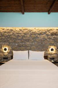 Ένα ή περισσότερα κρεβάτια σε δωμάτιο στο Stone Manor