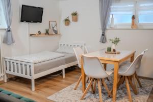 Postel nebo postele na pokoji v ubytování Gästehaus J. Baumann + 19 fotografií