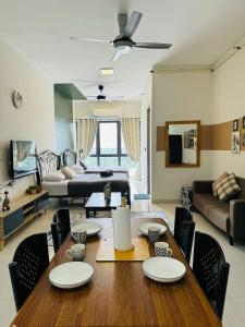 a living room with a table and a couch at CoreSoho Suite by BKAstaycation KotaWarisan Sepang KLIA Airport, Free Wifi in Sepang