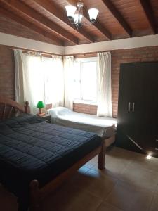 Ένα ή περισσότερα κρεβάτια σε δωμάτιο στο Los Tres Algarrobos +22 φωτογραφίες