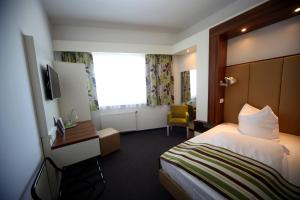 Postel nebo postele na pokoji v ubytování Hotel Alea City