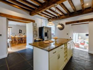 a kitchen with a counter and a dining room at 6 bed in Barnstaple 85615 in Tawstock