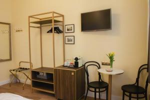 TV o dispositivi per l'intrattenimento presso Private Comfort STEPHANSPLATZ - SELF CHECK IN