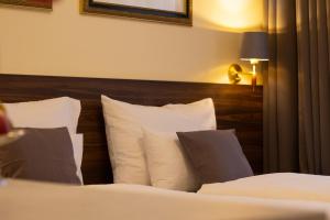 Letto o letti in una camera di Private Comfort STEPHANSPLATZ - SELF CHECK IN