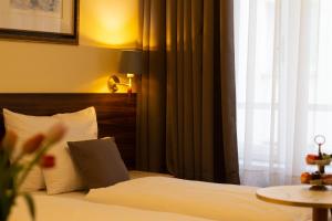 Letto o letti in una camera di Private Comfort STEPHANSPLATZ - SELF CHECK IN