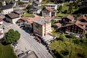 an aerial view of a small town with a street at Hotel Greina in Rabius