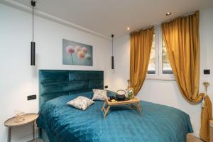 Postel nebo postele na pokoji v ubytování Apartments Alex