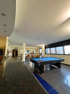 a pool table in the middle of a living room at iH Hotels Milano Blu Visconti in Trezzano sul Naviglio