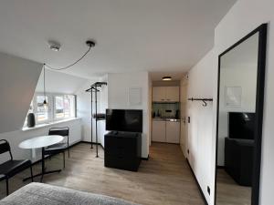 TV a/nebo společenská místnost v ubytování Studiowohnung 6 in Buxtehude