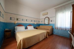 Postel nebo postele na pokoji v ubytování Hotel Diana