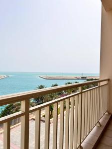a balcony with a view of the ocean at Nazeel - Sea view Marina Apt in King Abdullah Economic City