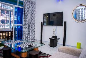 a living room with a glass table and a couch at SUNCOAST HOMES in Mtwapa