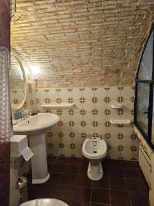 a bathroom with a sink and a toilet at Il Cortile nel Borgo in Lanciano +22 photos