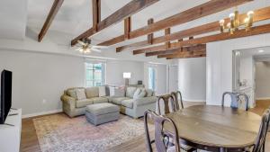 a living room with a table and a couch at Eagle's Roost Retreat - Near GSU in Statesboro