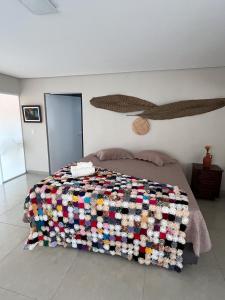 Ένα ή περισσότερα κρεβάτια σε δωμάτιο στο Pousada Encantos do Roncador