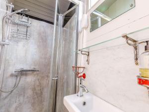 a bathroom with a shower and a sink at 1 Bed in Harrogate 81300 in Hampsthwaite