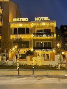a yellow building with christmas lights in front of it at MATEO HOTEL in Istanbul