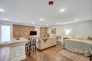 a bedroom with a bed and a desk at Eagle Exec Loft In Downtown Statesboro in Statesboro