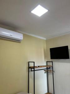 TV a/nebo společenská místnost v ubytování Recanto Caicara