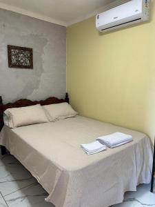 Postel nebo postele na pokoji v ubytování Recanto Caicara