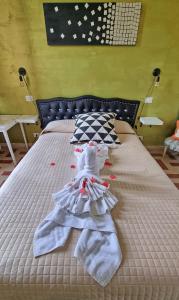 a bed with towels on top of it at GuestHouse Martin in Rome