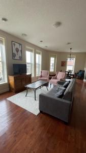 a living room with a couch and a coffee table at Market Place Living in Stratford