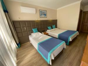 Postel nebo postele na pokoji v ubytování Prima Hotel