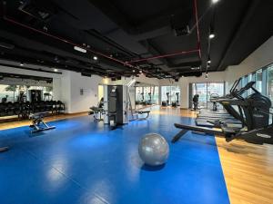a gym with exercise equipment and a ball on the floor at Silkhaus Burj Khalifa view large 2BDR in new tower in Dubai