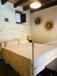 Llit o llits en una habitació de Bissantica, dimora storica nel cuore della Sardegna