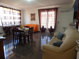 a living room with a couch and a table at Casa Vacanze Karol in Trappeto