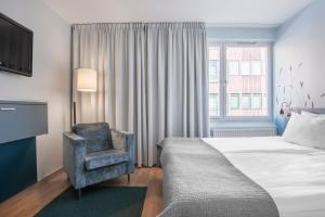 Postel nebo postele na pokoji v ubytování Quality Hotel Grand Kristianstad