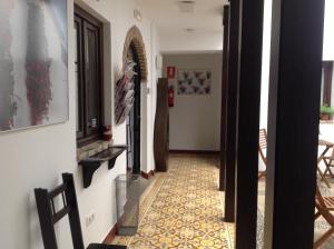 a hallway of a house with a tile floor at Hospederia Alma Andalusi in Córdoba