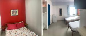 Postel nebo postele na pokoji v ubytování Suítes Ponta Leste