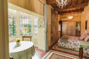 a bedroom with a bed and stained glass windows at The Perfect Place in Ravenna