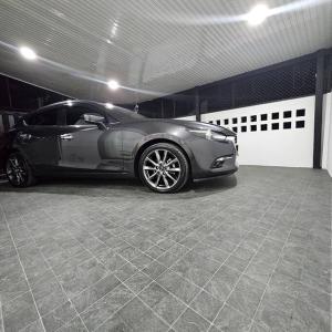 a silver car parked in a garage at 52PrivateHouse in Lampang