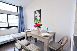 a dining room with a table and chairs at Manchester city center luxury in Manchester