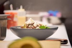 a bowl of food sitting on top of a table at Loews Kansas City in Kansas City