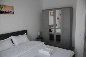 Katil atau katil-katil dalam bilik di Real Resort- Apartament perfect pentru sejurul tau!