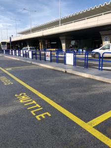 a parking lot with yellow writing on the road at Rome Airport Hotel Fiumicino in Fiumicino